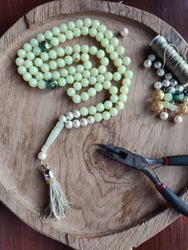 Praying beads, pliers, and strings