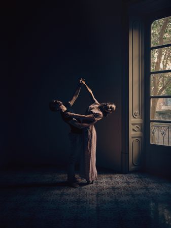 Couple dancing in dark room