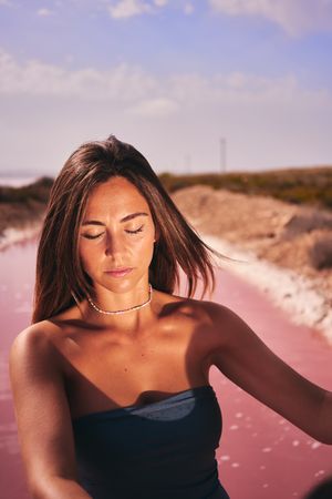 Bronzed female in swimsuit in sunlight
