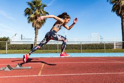woman running on stadium