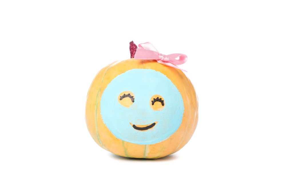 Pumpkin with facial mask and bow