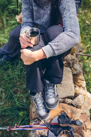 Woman pausing while doing trekking