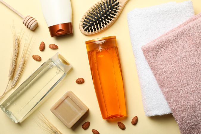 Composition of personal hygiene with bottles of cosmetics on beige background