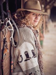 Stylish fair haired female in cowboy wear