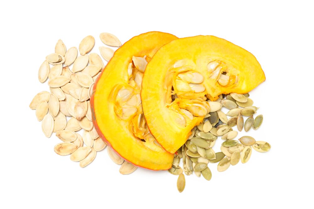 Concept of Autumn vibe food, Pumpkin, Pumpkin seeds, isolated on light background