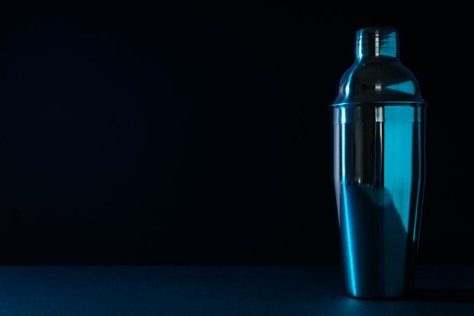 Concept of preparing cocktail, shaker, space for text