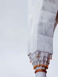 Gold details of marble pillar