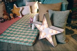 Children's play area with mats and cushions