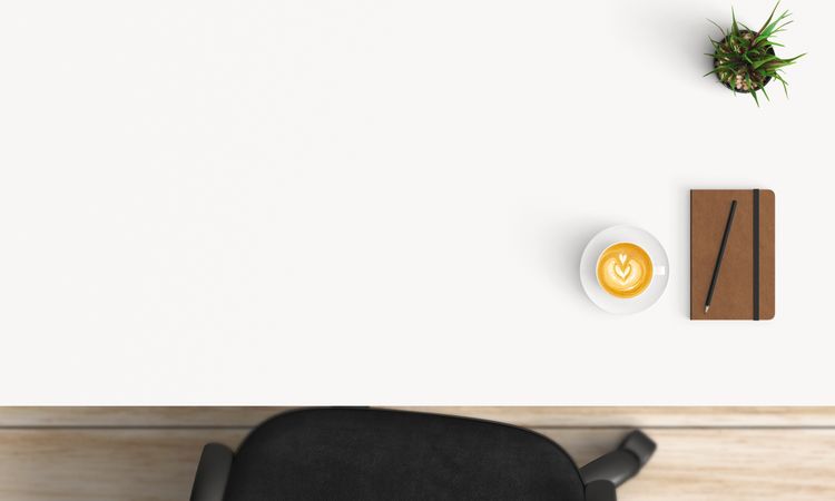 Modern workplace with coffee cup and smartphone or laptop copy space on table background. Top view. Flat lay style.