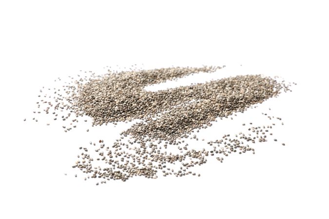 Many chia seeds isolated on blank background