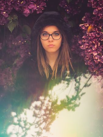 Woman on background of stunning violet flowers