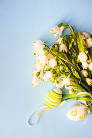 Easter holiday card concept with snowdrops and decorative eggs