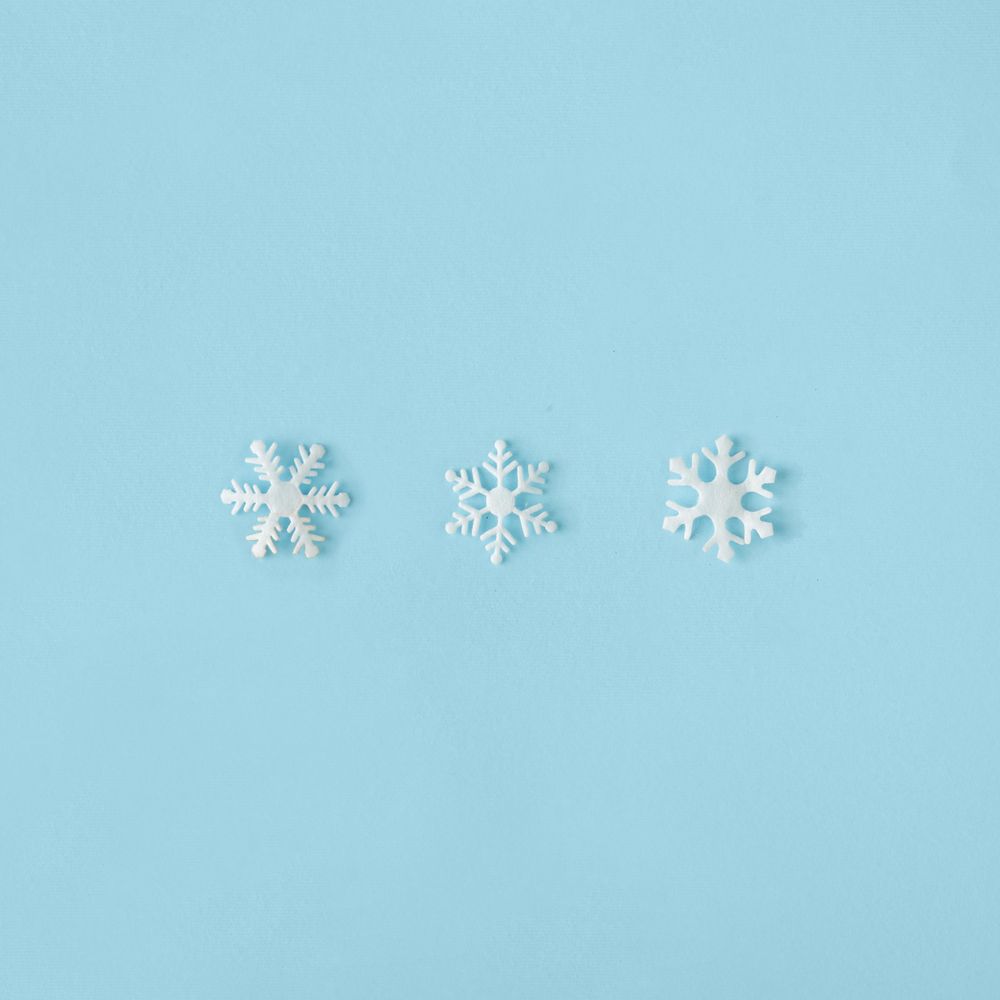 Row of snowflakes on blue background