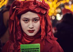 Japan - Tokyo, Shibuya Japan - November 29th, 2019: Portrait of woman from Red Rebel Brigade