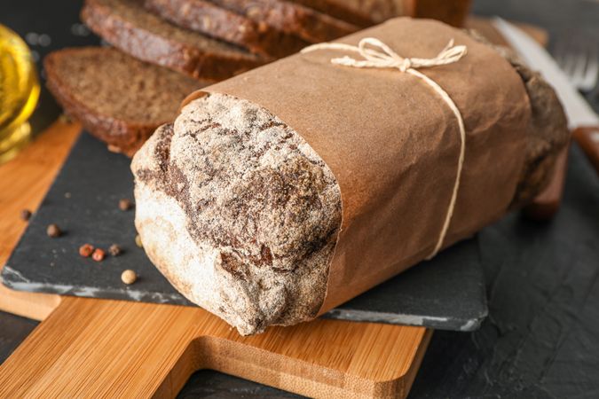 Composition with bread on cutting board, space for text and closeup