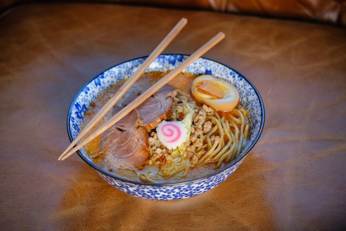 Asian noodle soup with chopsticks in bowl