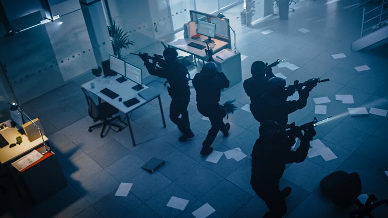 Soldiers with Rifles and Flashlights Move Forwards and Cover Surroundings. Above-view Camera.