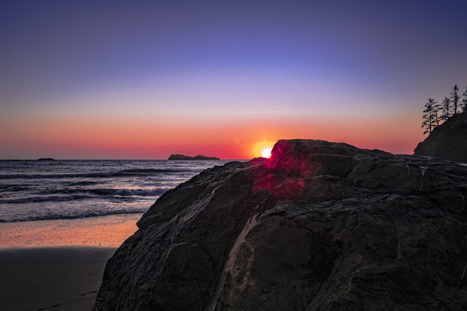 Waves coming into beach during beautiful sunset