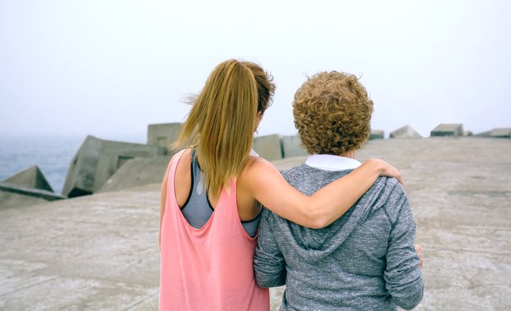 Mature woman and young woman walking