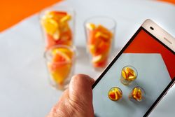Photo of sliced citrus fruits on mobile phone