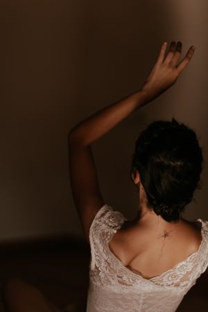 woman sitting in dark room