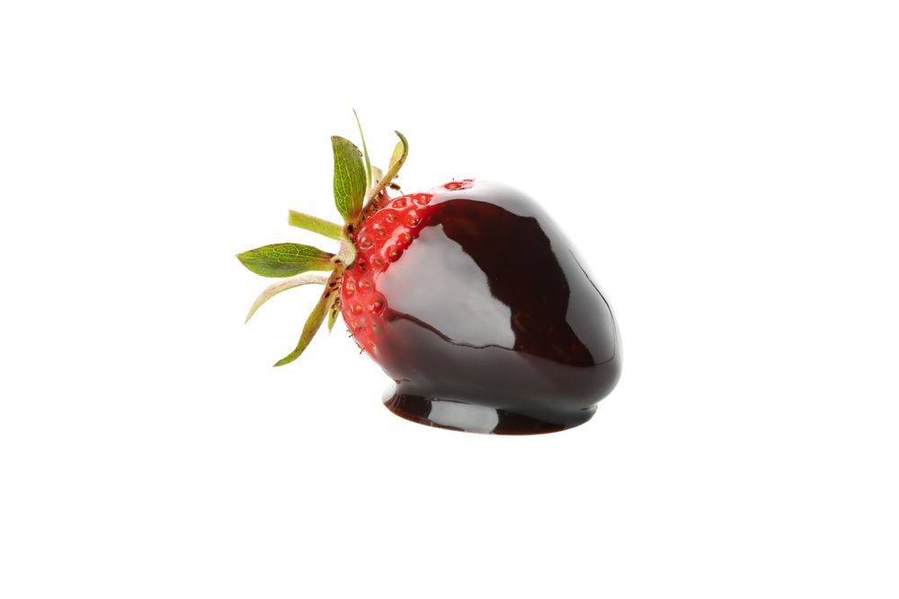 Chocolate fondue. Strawberry in chocolate sauce isolated on blank background