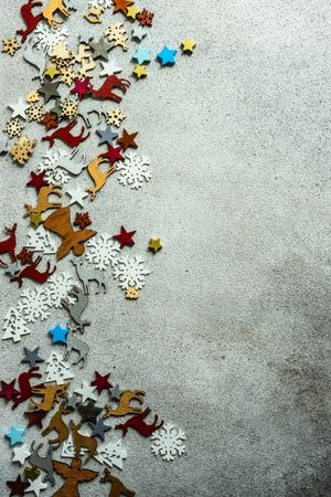 Flat Christmas ornaments scattered on concrete background