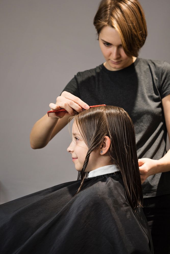 Child client sitting in hair salon