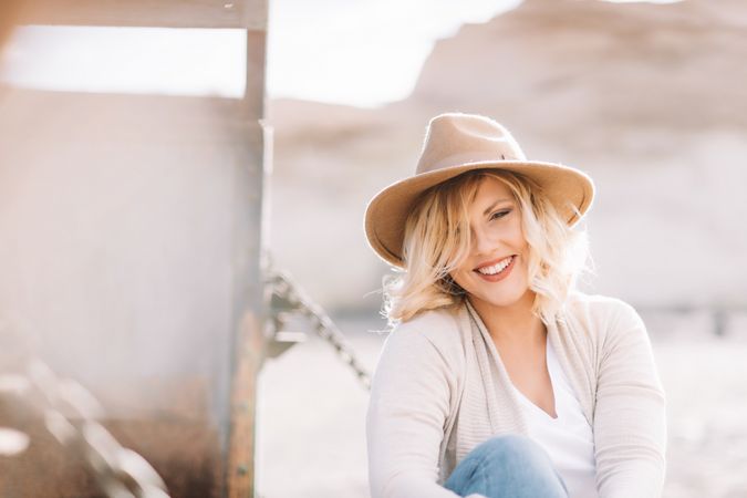 Cheerful woman having rest in countryside