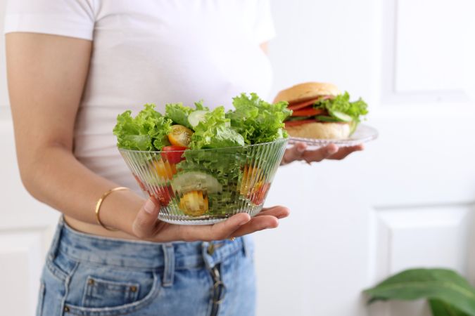 Person Choosing Salad over a Hamburger