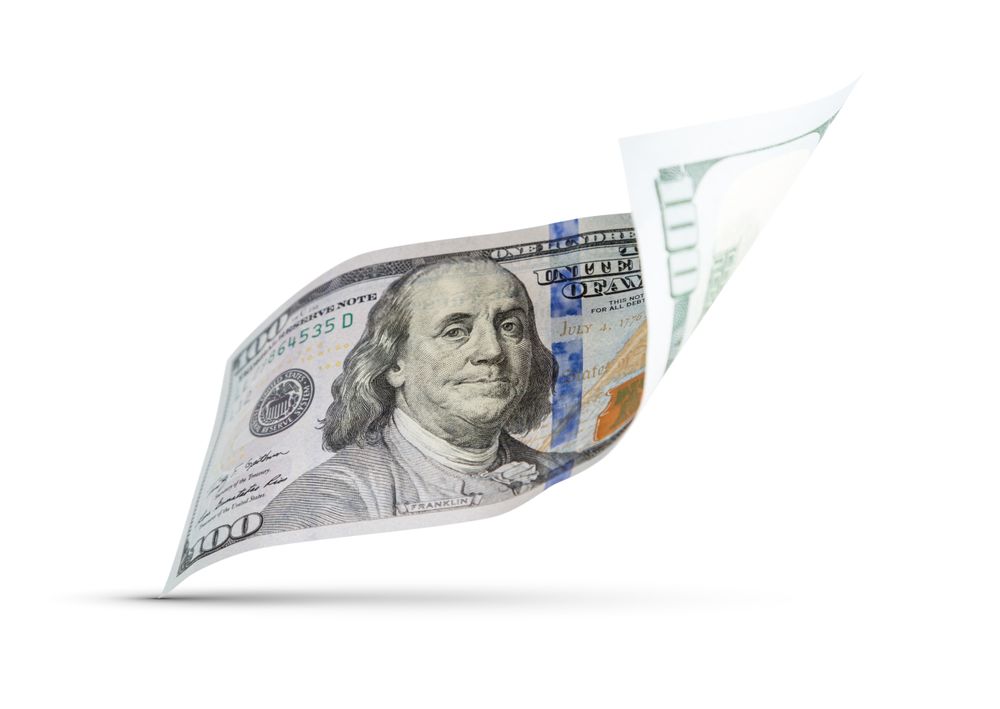 One Hundred Dollar Bill Floating Down To Surface with Drop Shadow