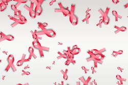 Scattered pink ribbons on bright background