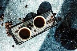 Cup of coffee on stone background