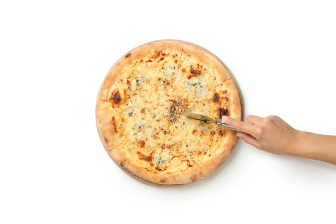 Female hand cut cheese pizza on neutral background