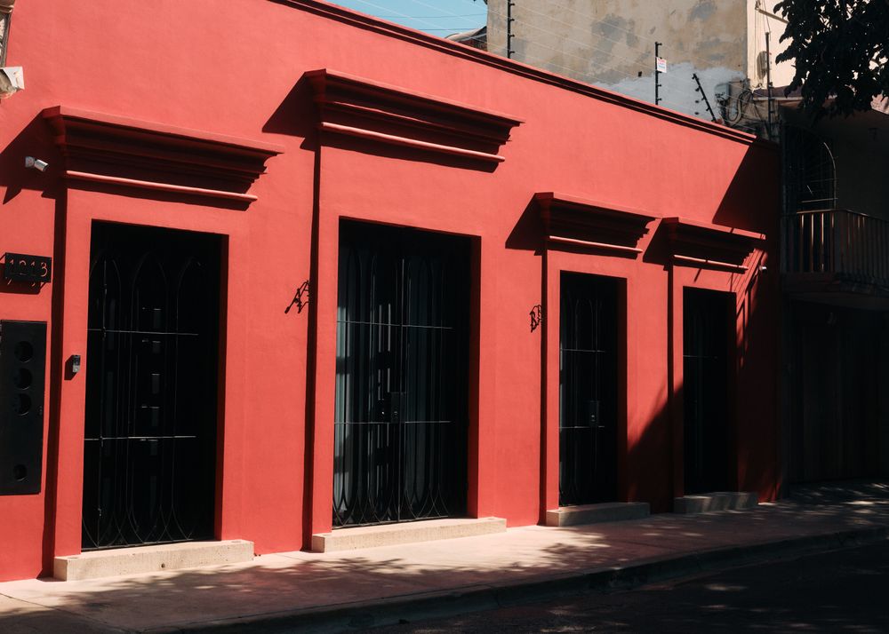 Red building with dark large doors
