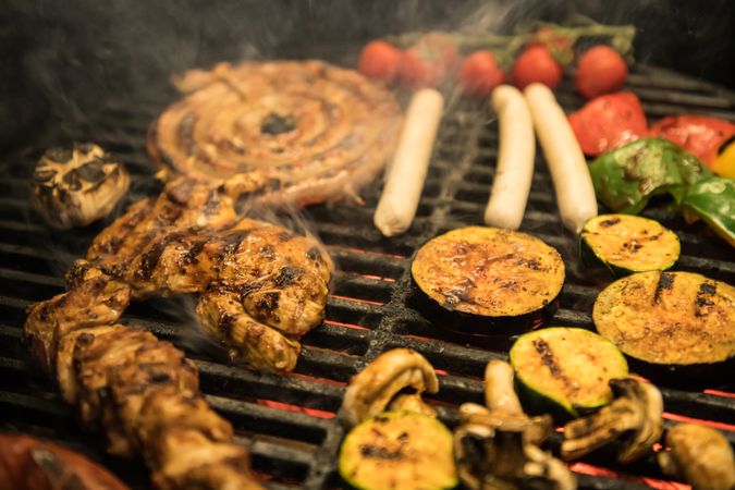 Vegetables and meat on grill