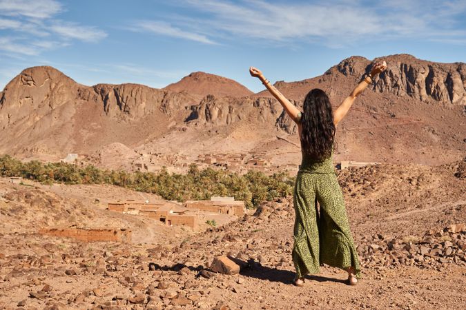 Woman between desert near mountains