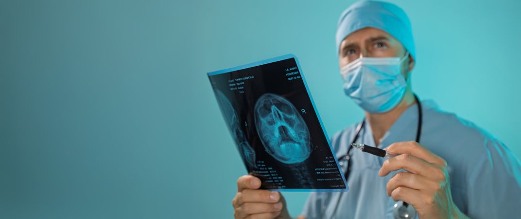 Doctor Holding X-Ray Banner