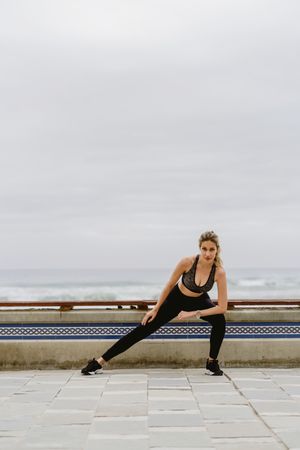 Sportswoman working out at city street