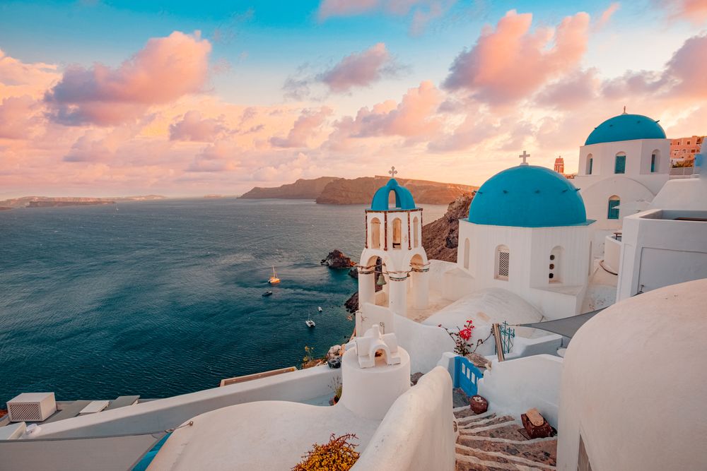 Blue domes of Santorini over the Aegean Sea