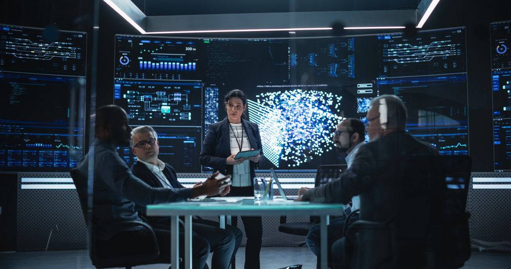 Chief Software Engineer Conducting a Quality Assessment Meeting With His Artificial Intelligence Design Team.