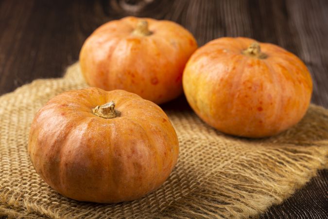 Pumpkins on the wooden table.