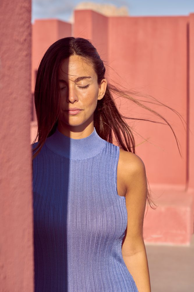 Woman with closed eyes in sunlight