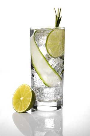 Tasty cocktail in glass with lemon