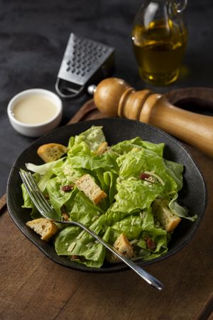 Caesar salad with croutons and bacon.