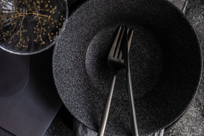 Dark table setting with delicate dried flower decor