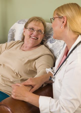 Doctor or Nurse Talking to Sitting Woman