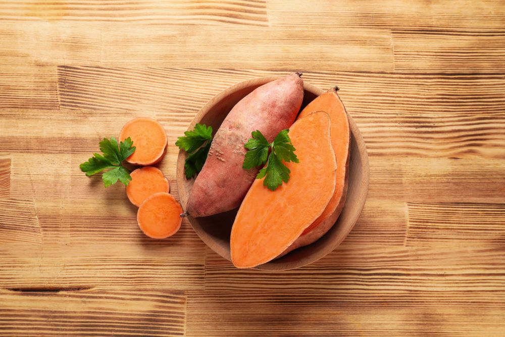 Concept of vegetables, sweet potato, top view