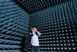 Woman in sound room listening to music