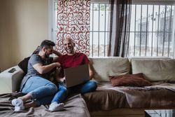 Gay couple with computer
